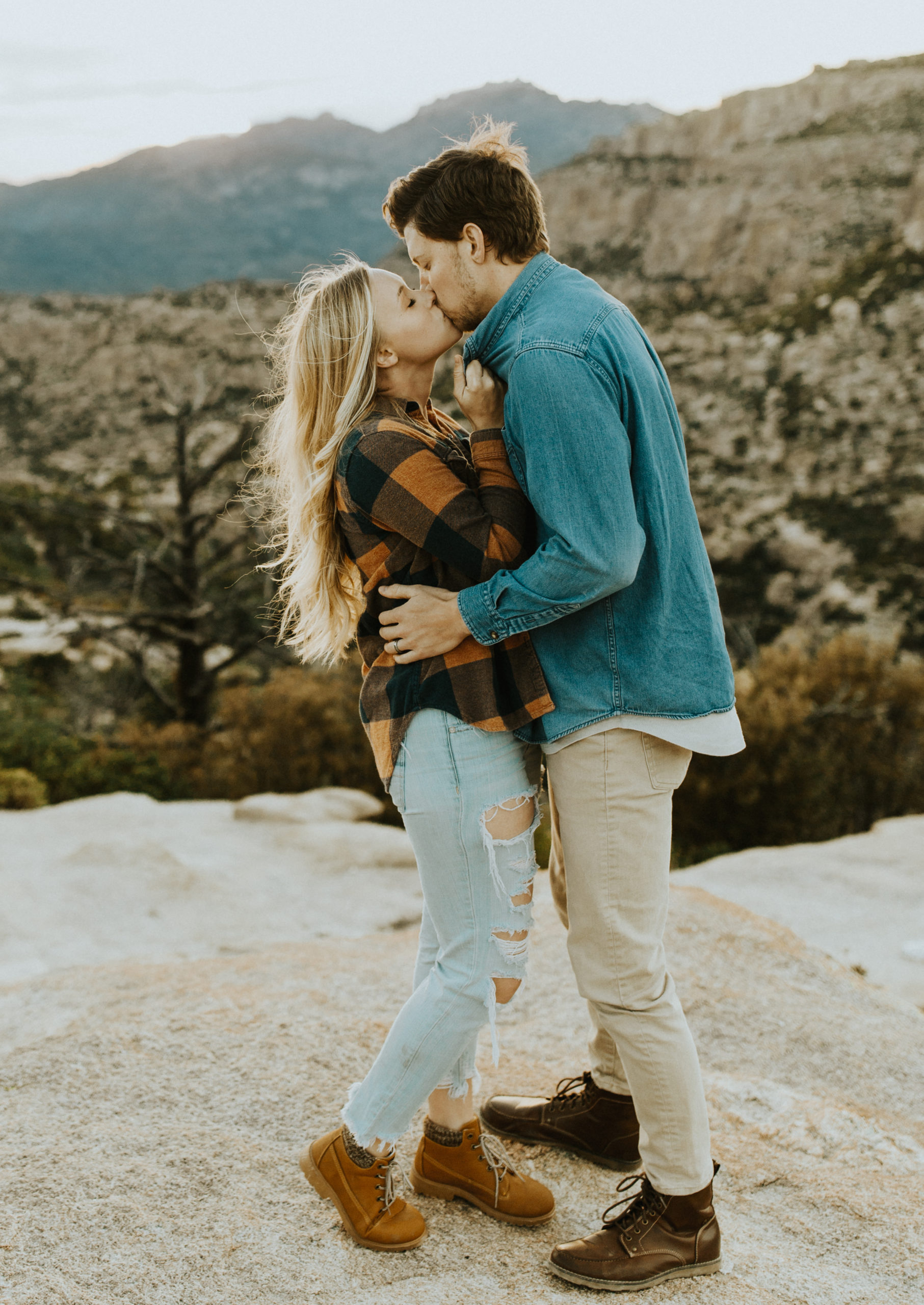 Engagement photo in Tucson Arizona with a female in plaid shirt and male in denim shirt