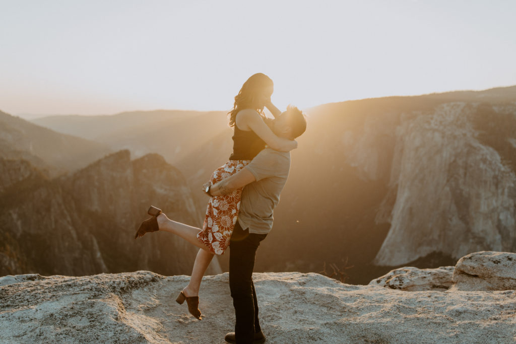 Engaged couple at Taft Point, Yosemite during sunset