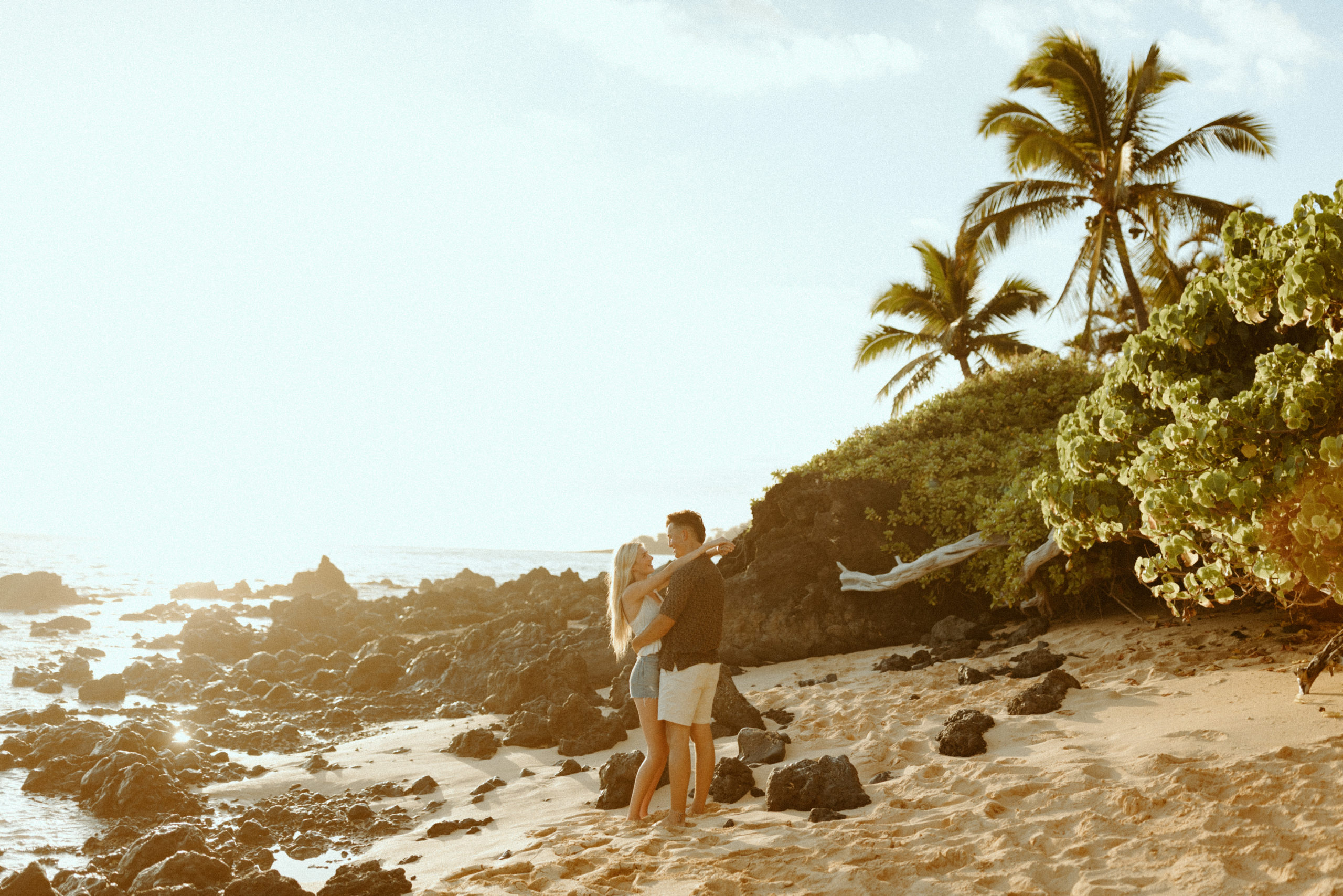 couple standing together in the sunlight in Hawaii