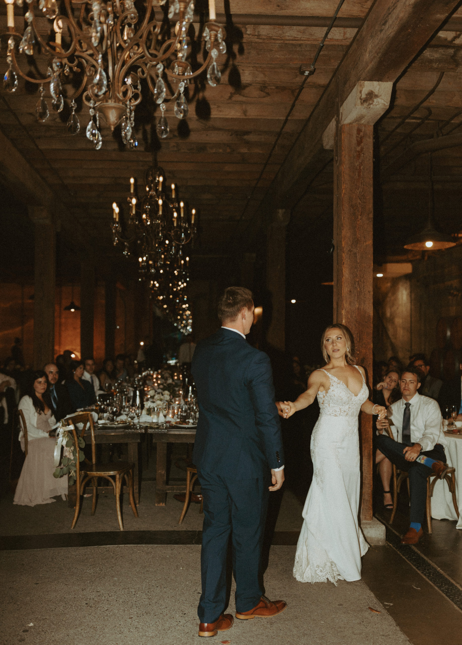 the couple doing their first dance at the vineyard in California