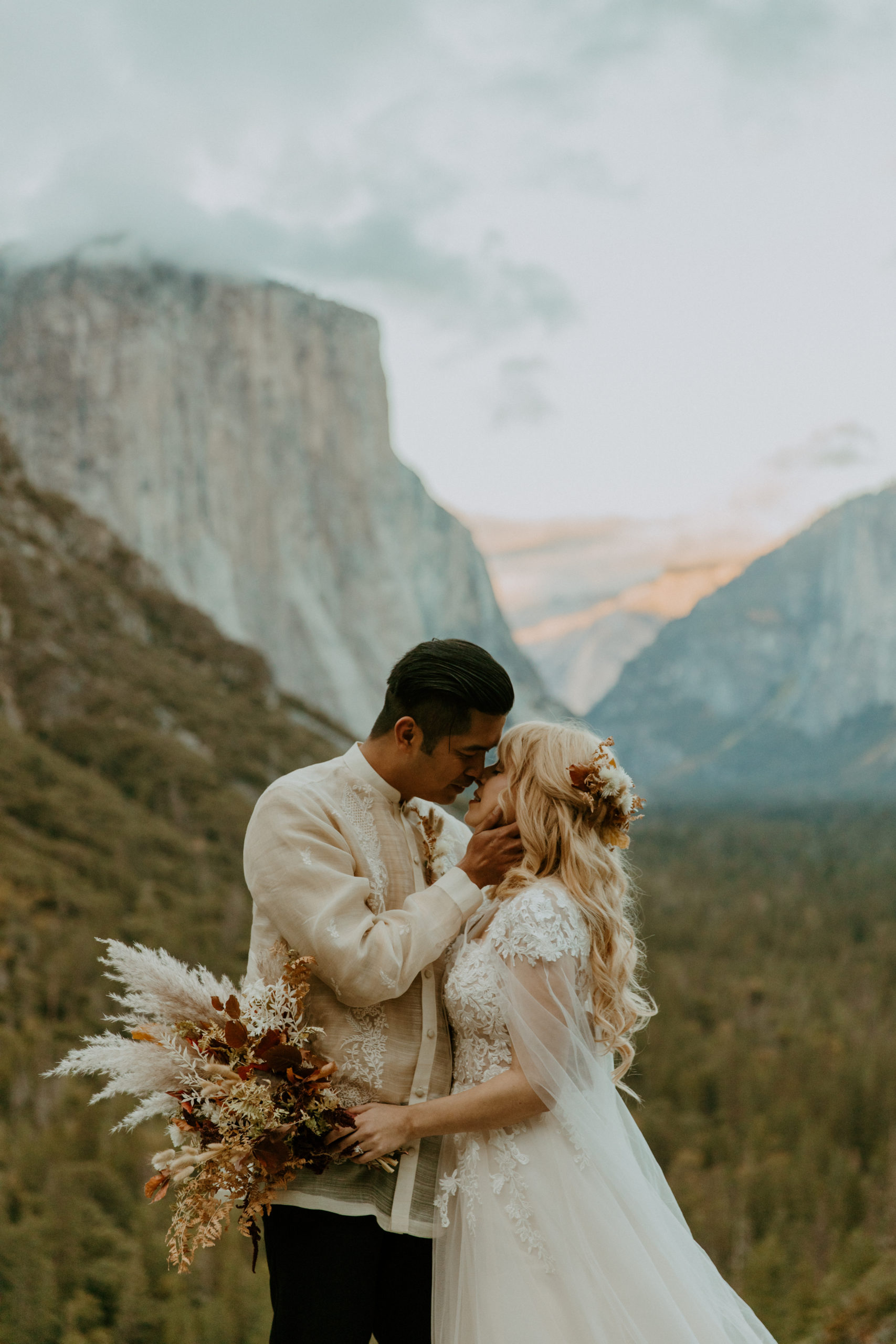 the couple kissing during blue hour during their elopement in Yosemite
