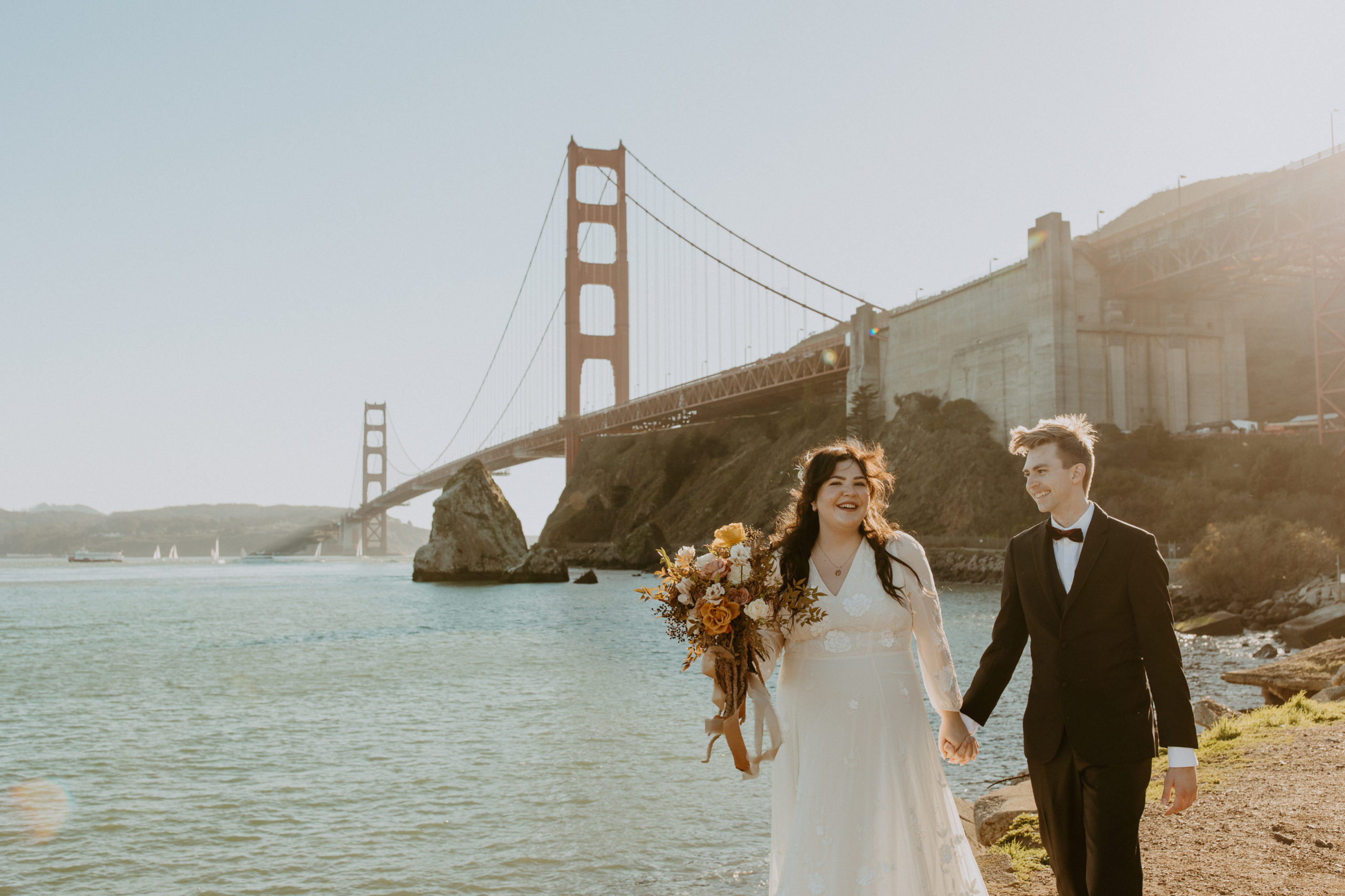 the couple walking away from the Golden Gate Bridge