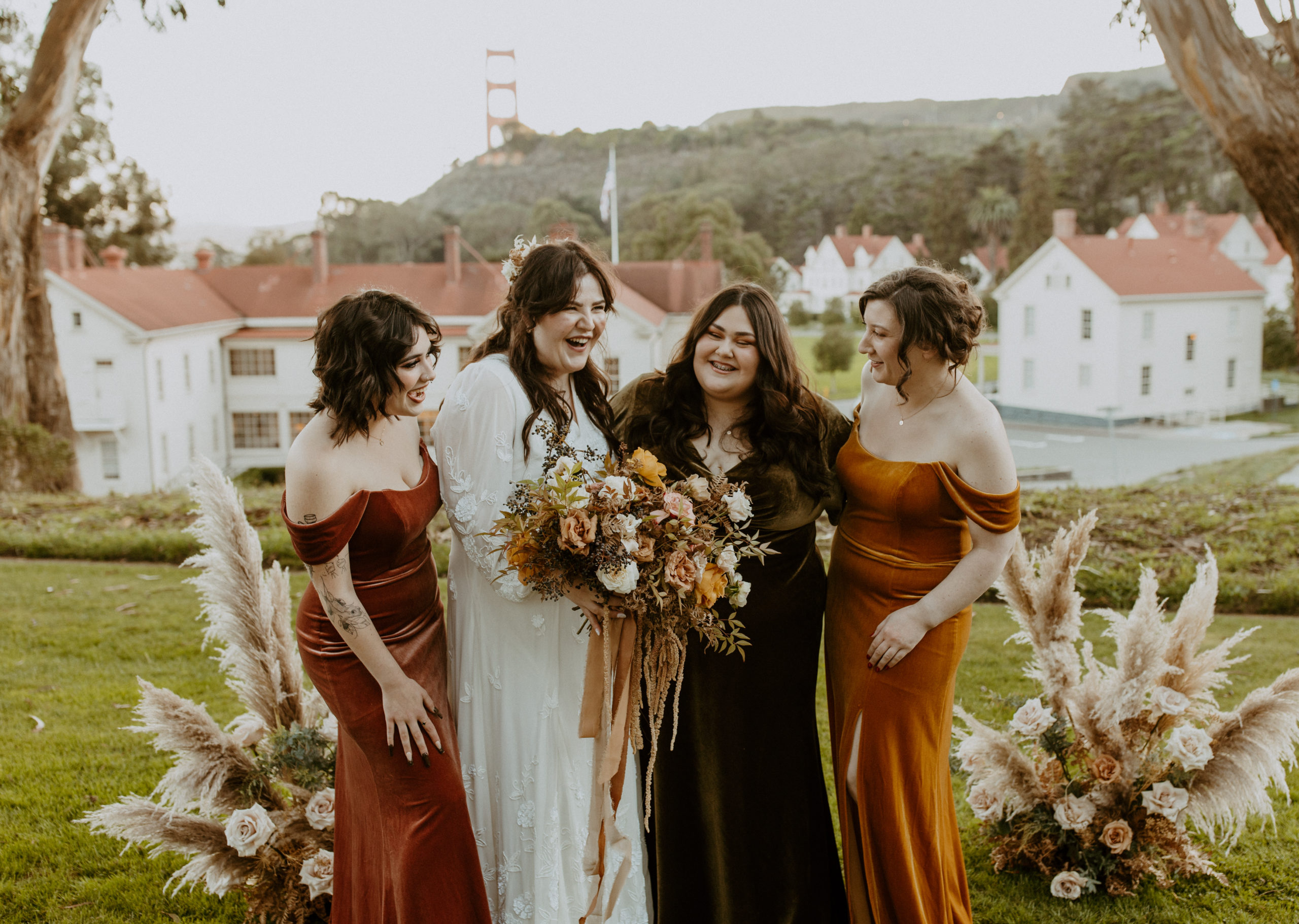 the bride and her bridesmaids laughing together