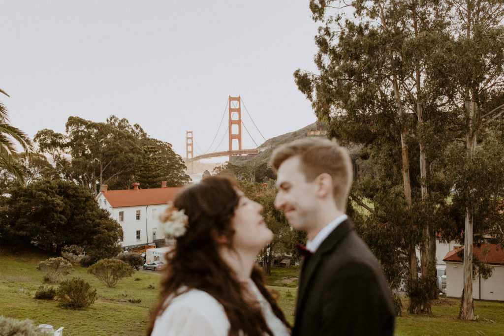 the couple standing in front of the Golden Gate Bridge