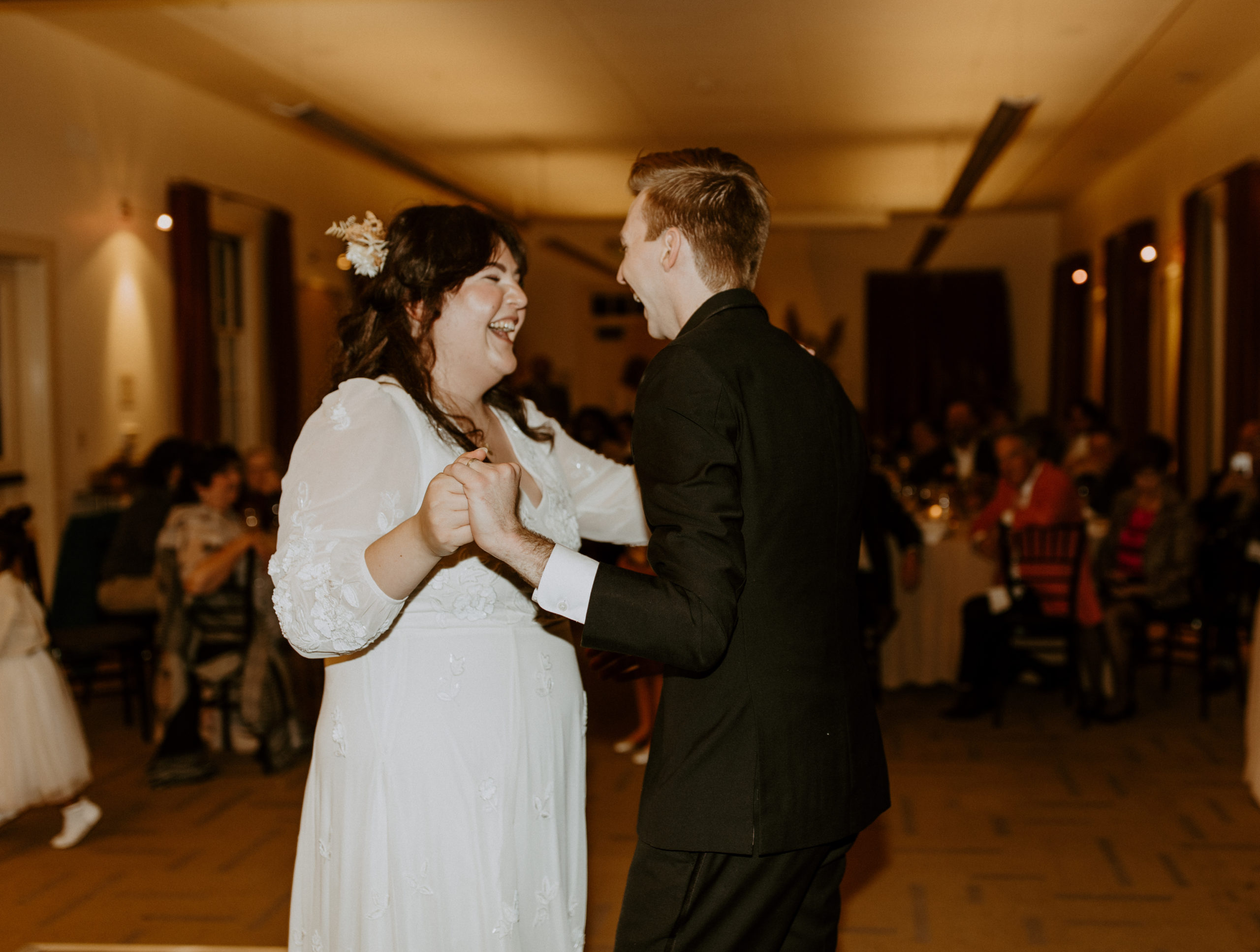 the bride and groom dancing together