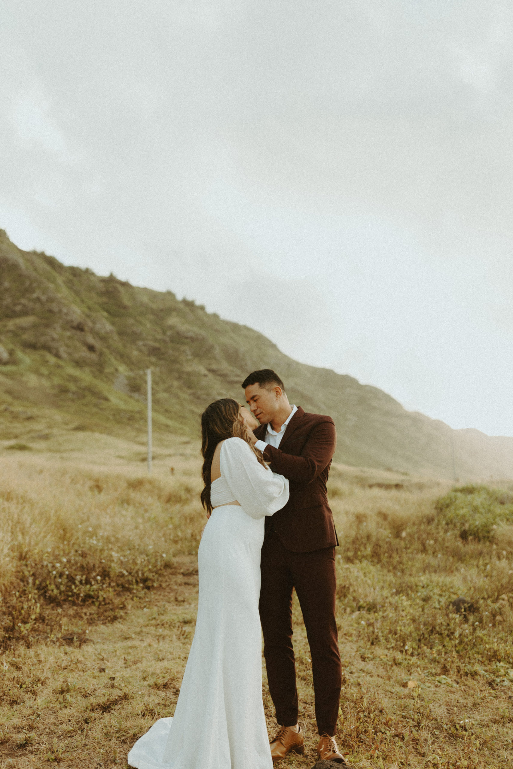 the couple leaning into kiss at their Oahu Sunset Bridals