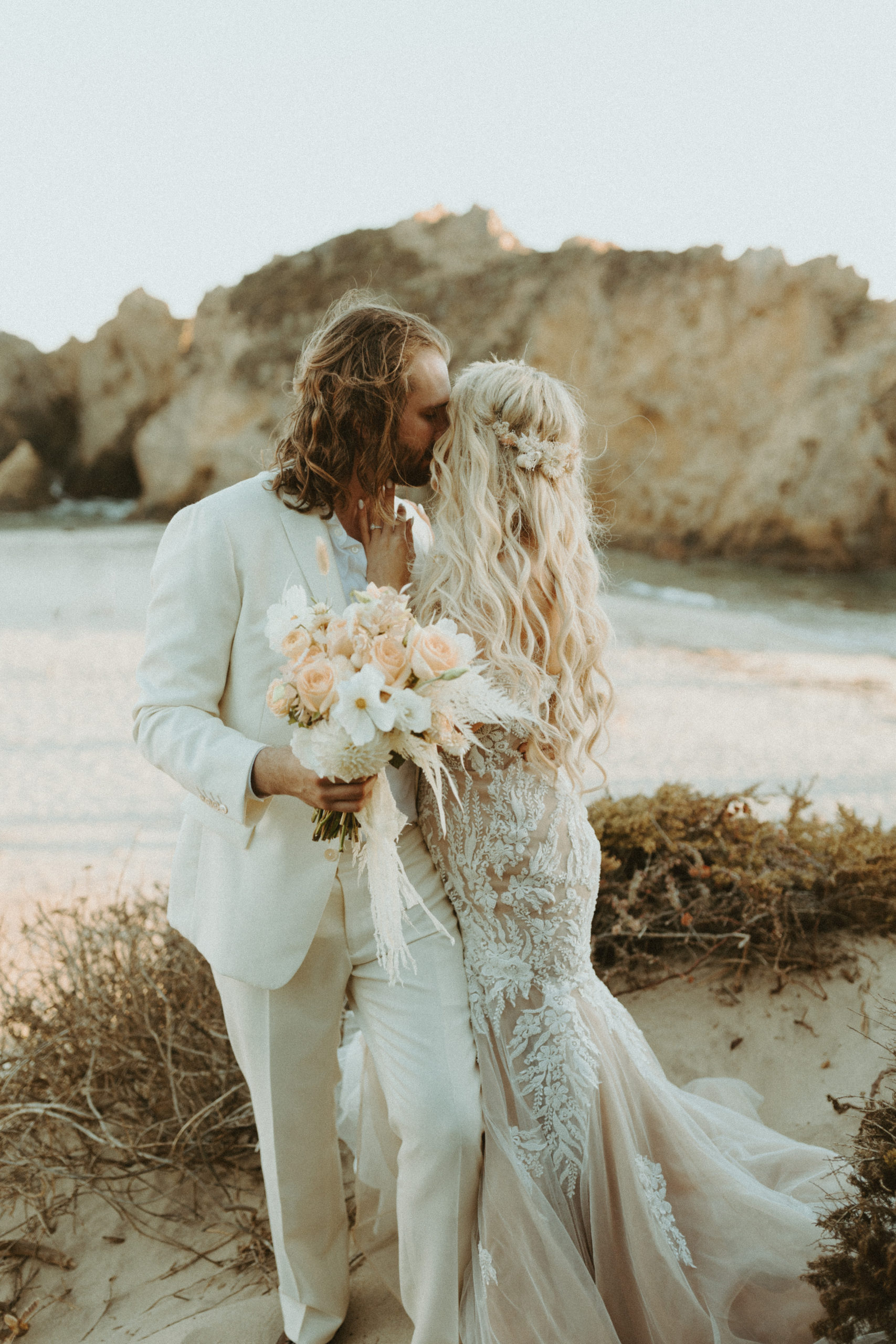 the couple touching noses at their Big Sur wedding