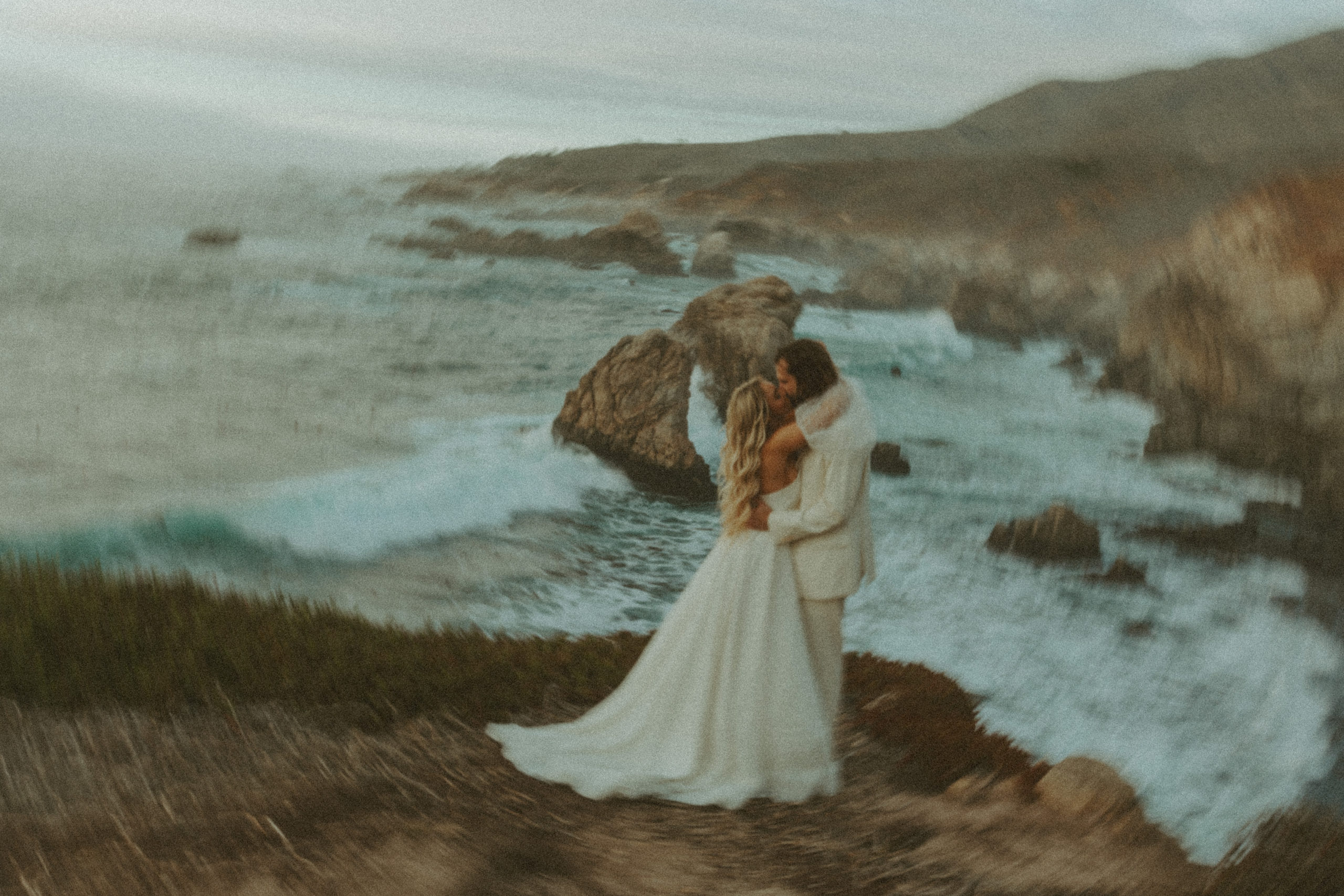 the bride and groom hugging at Big Sur