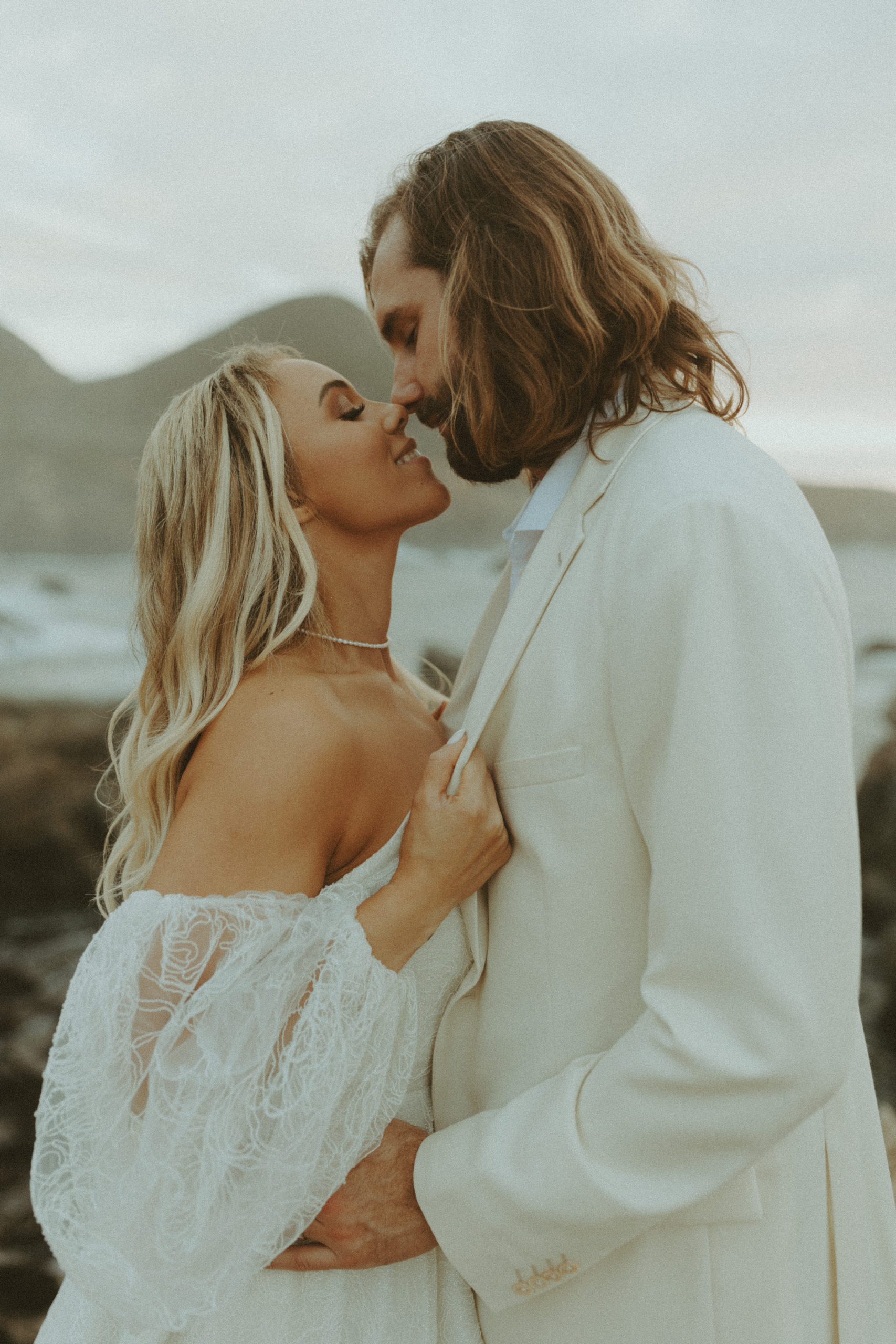 the couple leaning in about to kiss at their Big Sur elopement