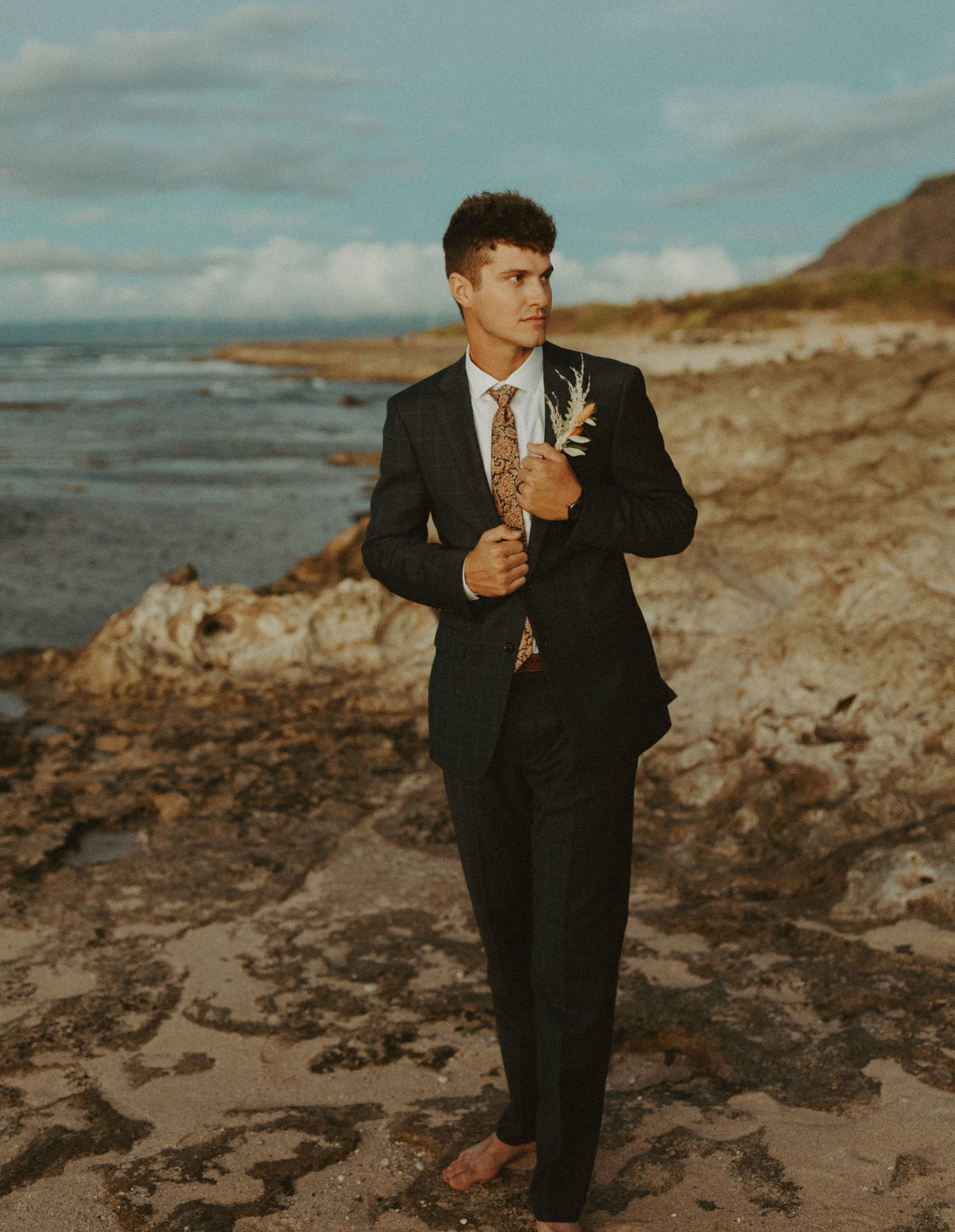 the groom on the beach during his Hawaii elopement