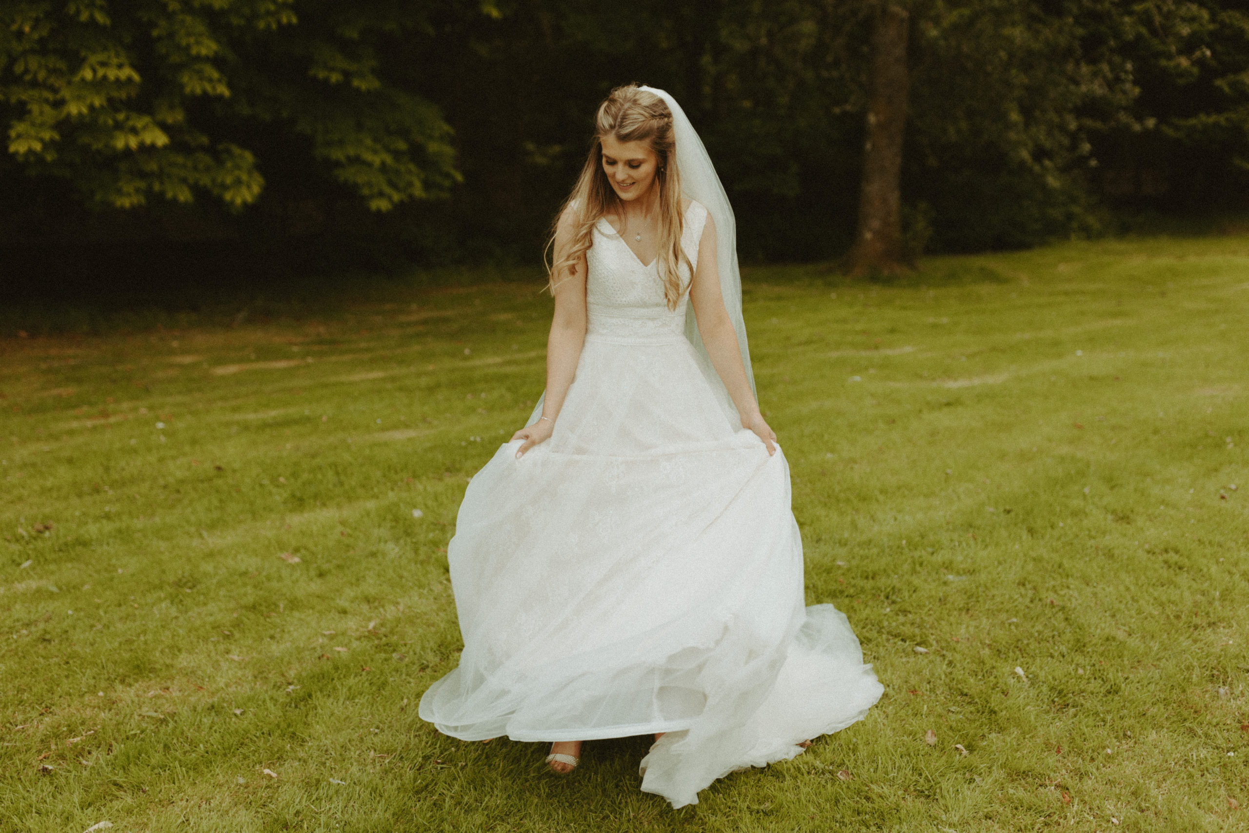 the bride twirling her wedding dress