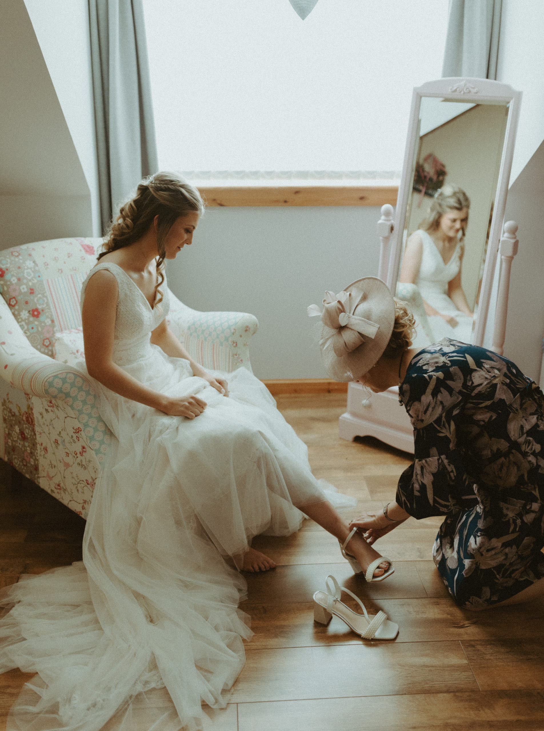 the bride putting on her shoes