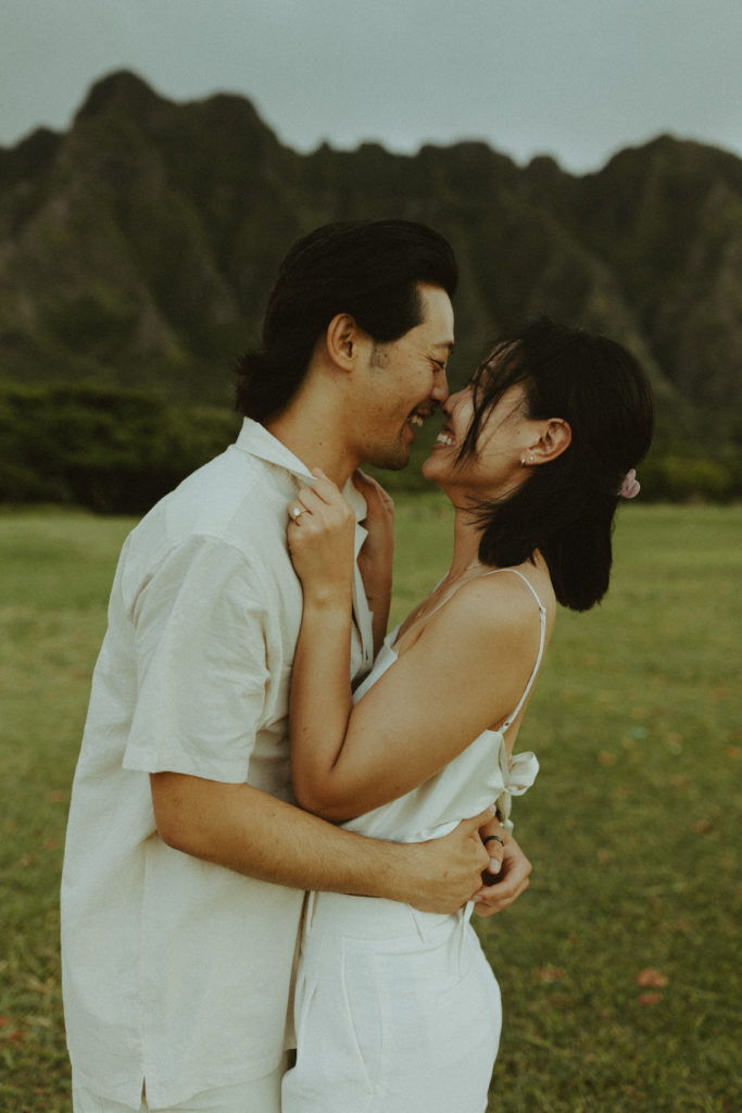 the couple leaning in for a kiss in Hawaii during their engagement pictures