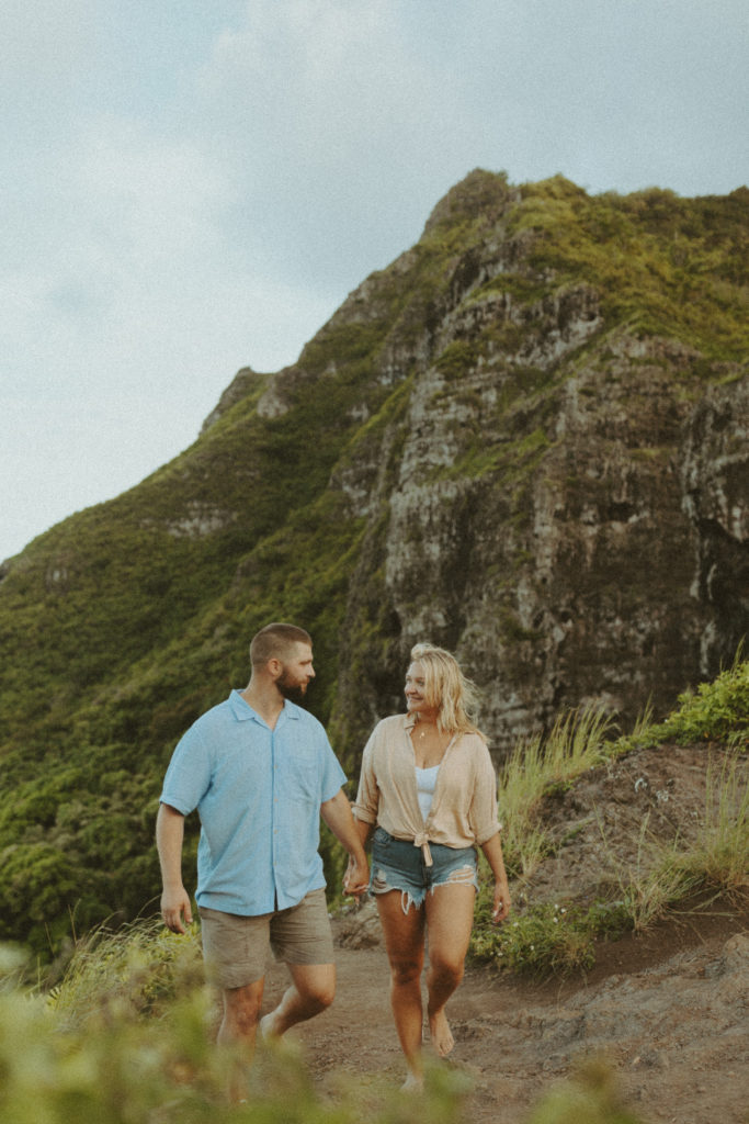 couple walking towards Hawaii couples photographer during their photoshoot
