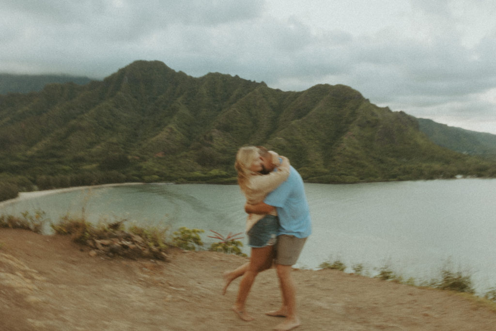 the couple wrapped in each other's arms in Hawaii