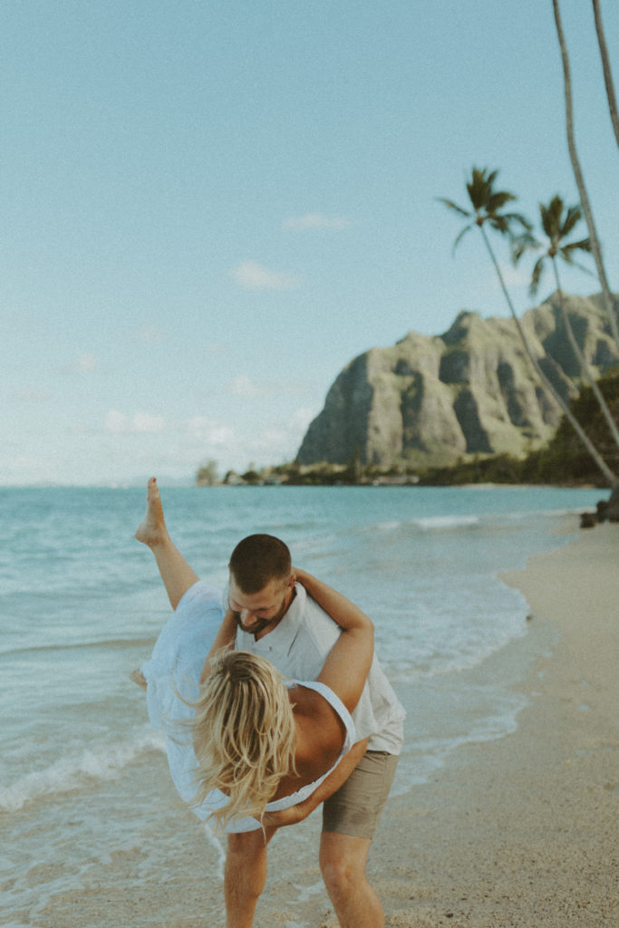the couple on the beach for a couples photoshoot in Hawaii