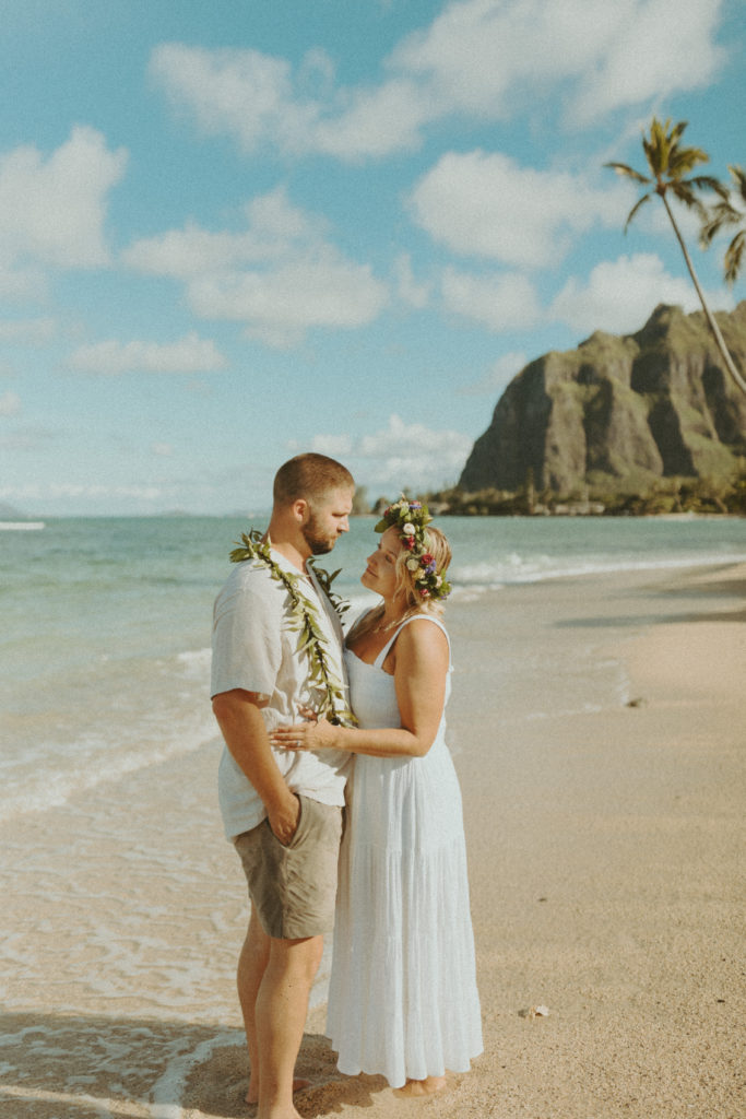 the couple getting their photos taken in Hawaii for their anniversary 