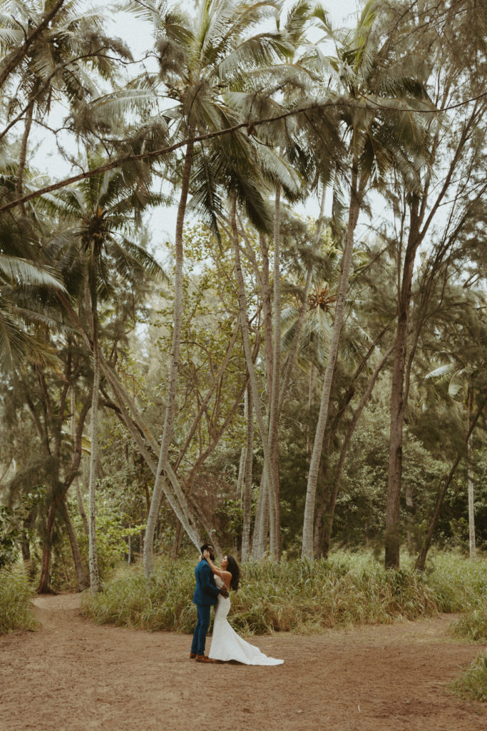 the wedding couple in Hawaii hugging for wedding photography