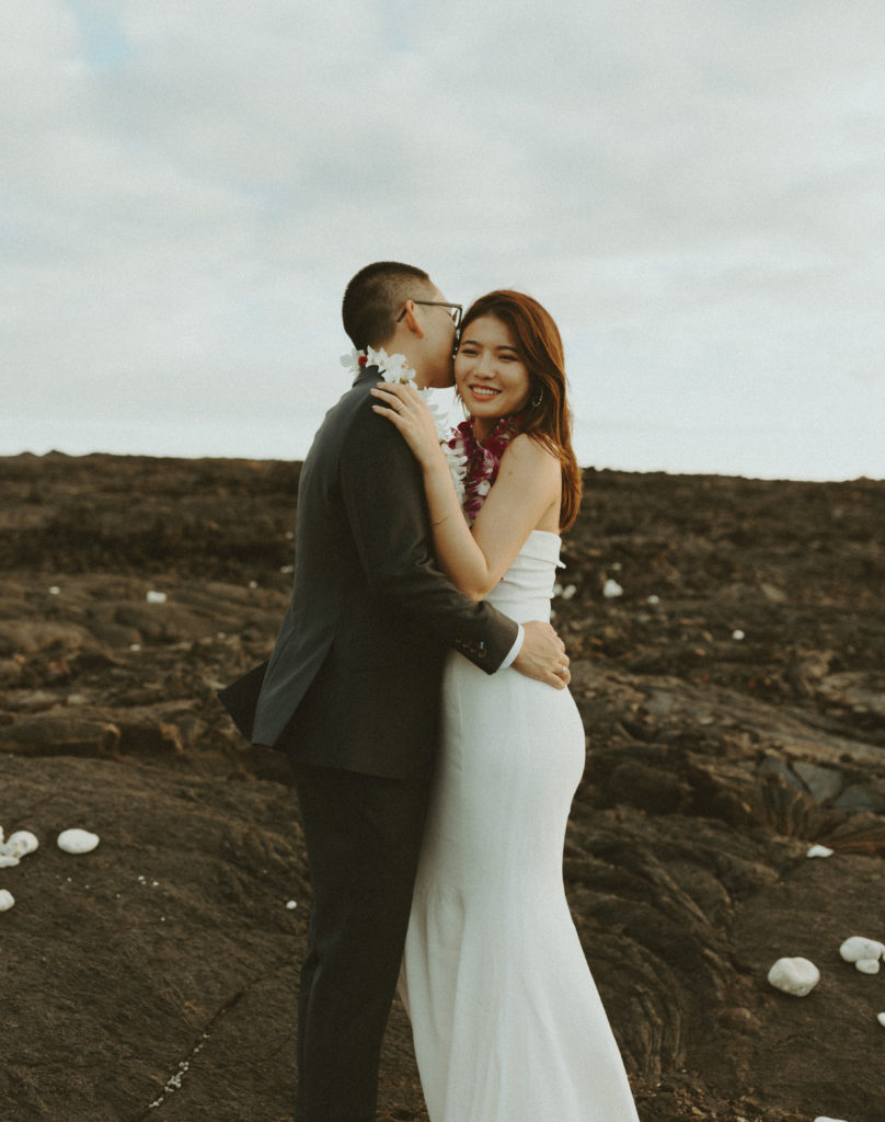 the couple smiling as the Hawaii wedding photographer captures them 
