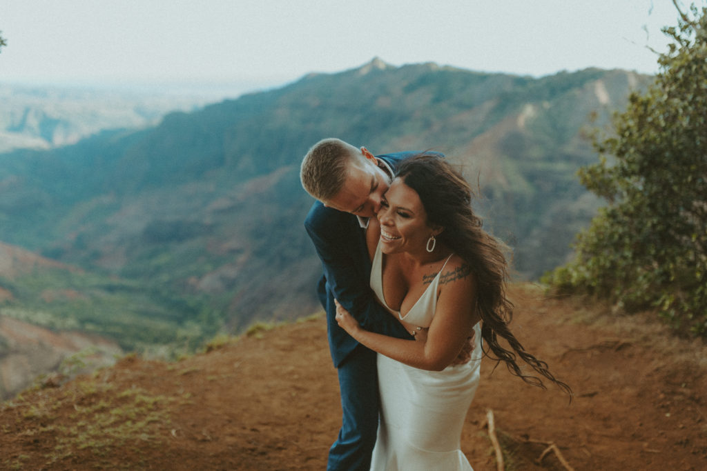 the couple laughing with each other during their Hawaii elopement