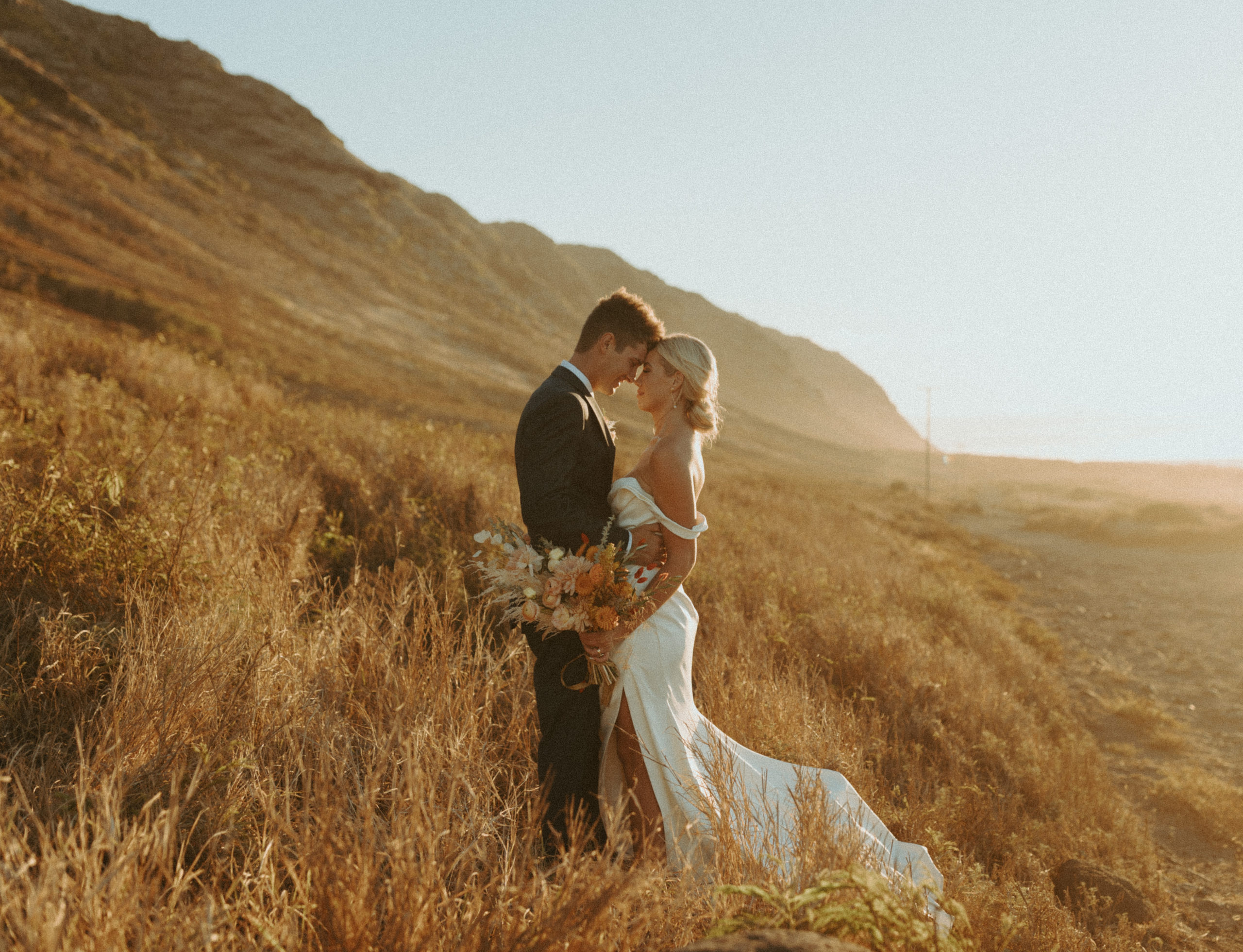 the bride and groom posing in Hawaii