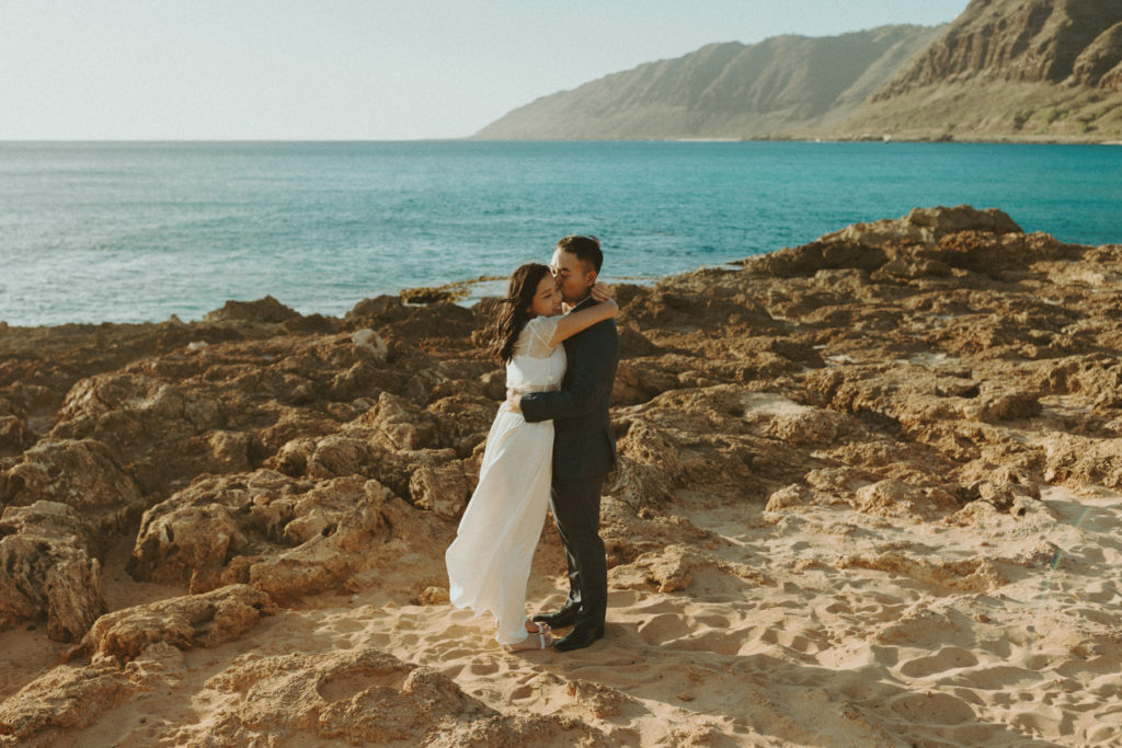 bride and groom posing in hawaii after their elopement