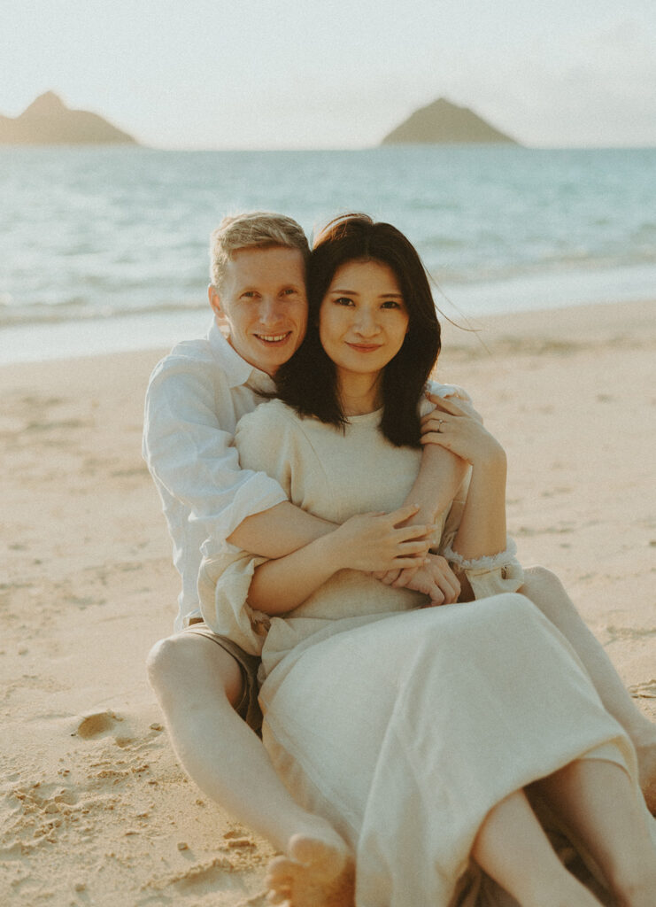 Couple posing for their photos on the beach in oahu
