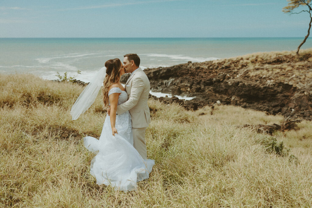 couple posing on big island for their wedding photos

