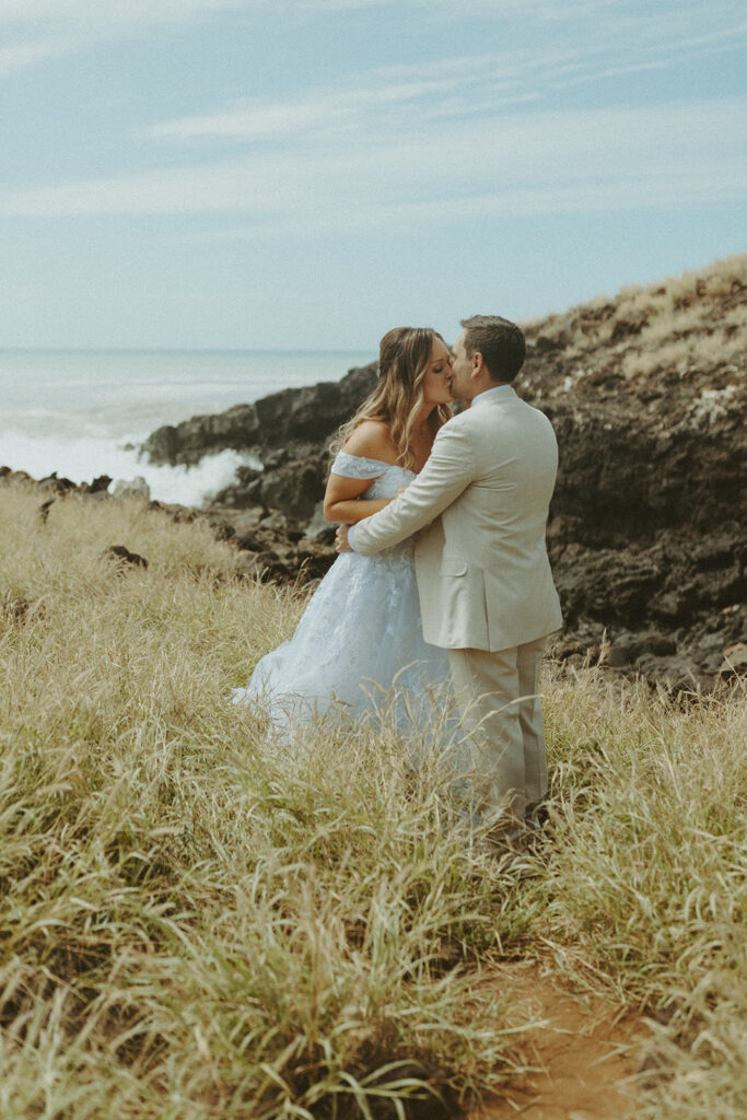 bride and groom posing on the beach for their destination wedding photos | A Peaceful and Laid Back Big Island Hawaii Wedding