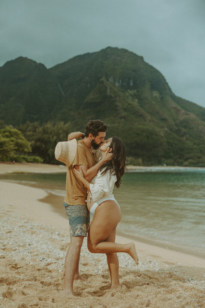boho maternity session of couple posing on kauai for their maternity photos