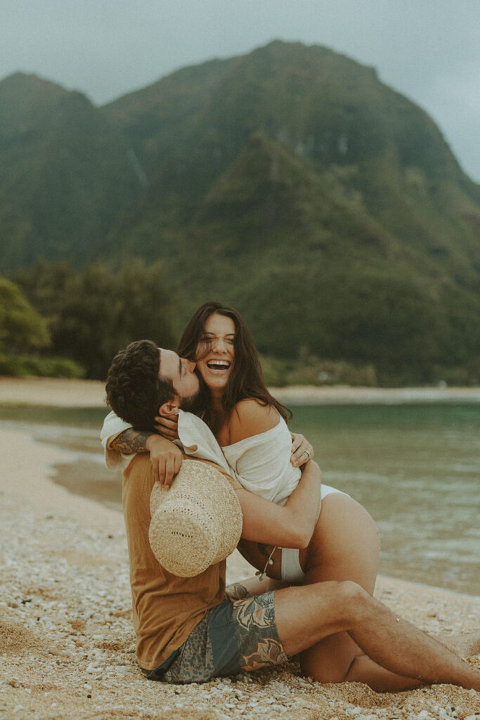 boho maternity session of couple posing on kauai for their maternity photos