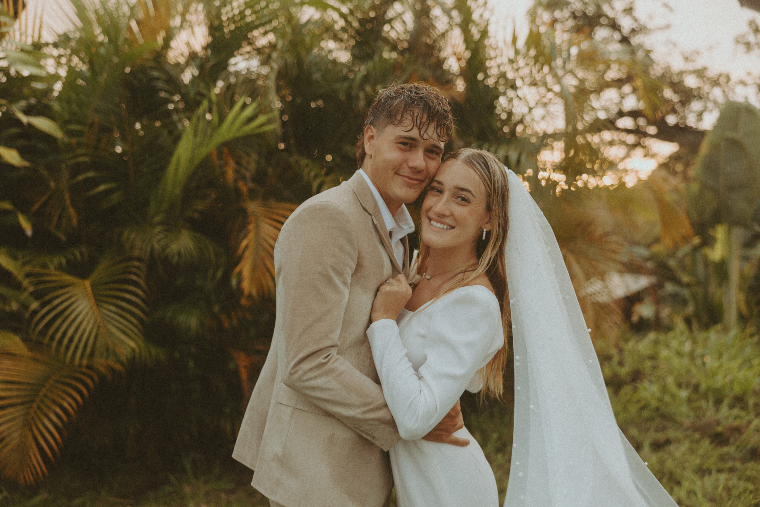 couple posing in hawaii for their wedding photos