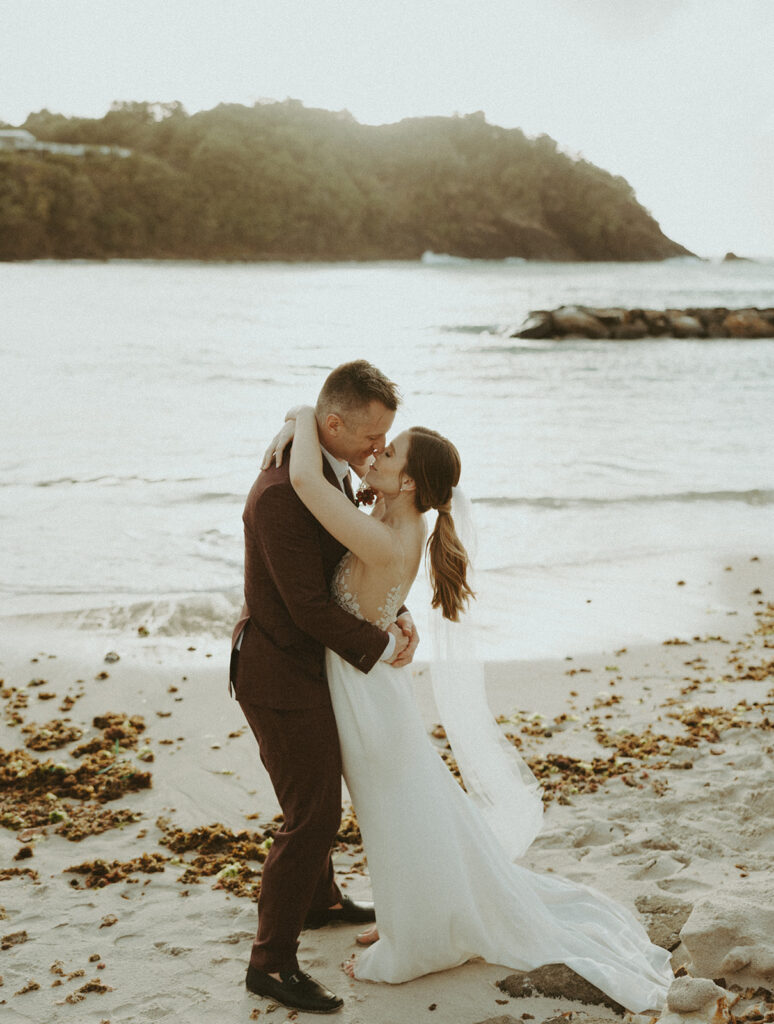 bride and groom posing for their wedding portraits in st lucia - valory evalyn