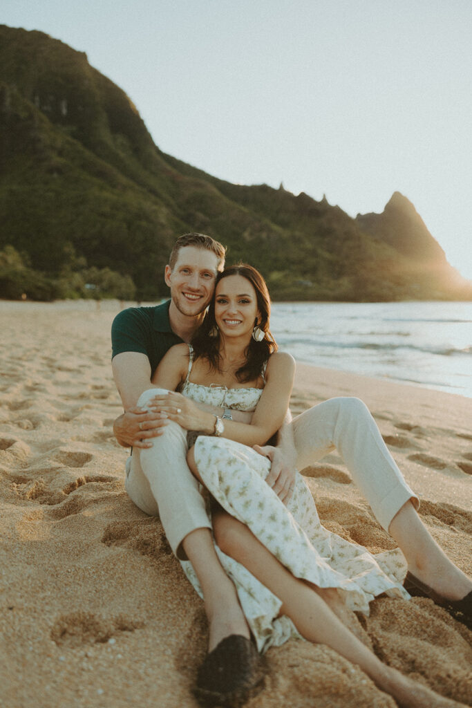 couple on the beach having an engagement photoshoot
