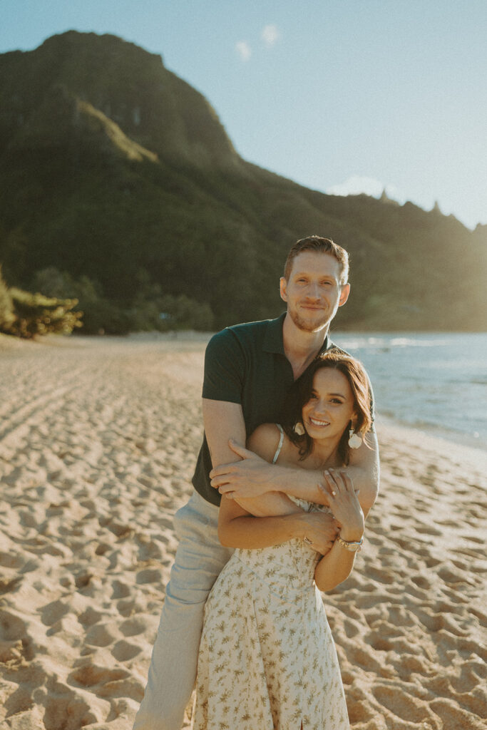 couple on the beach having an engagement photoshoot