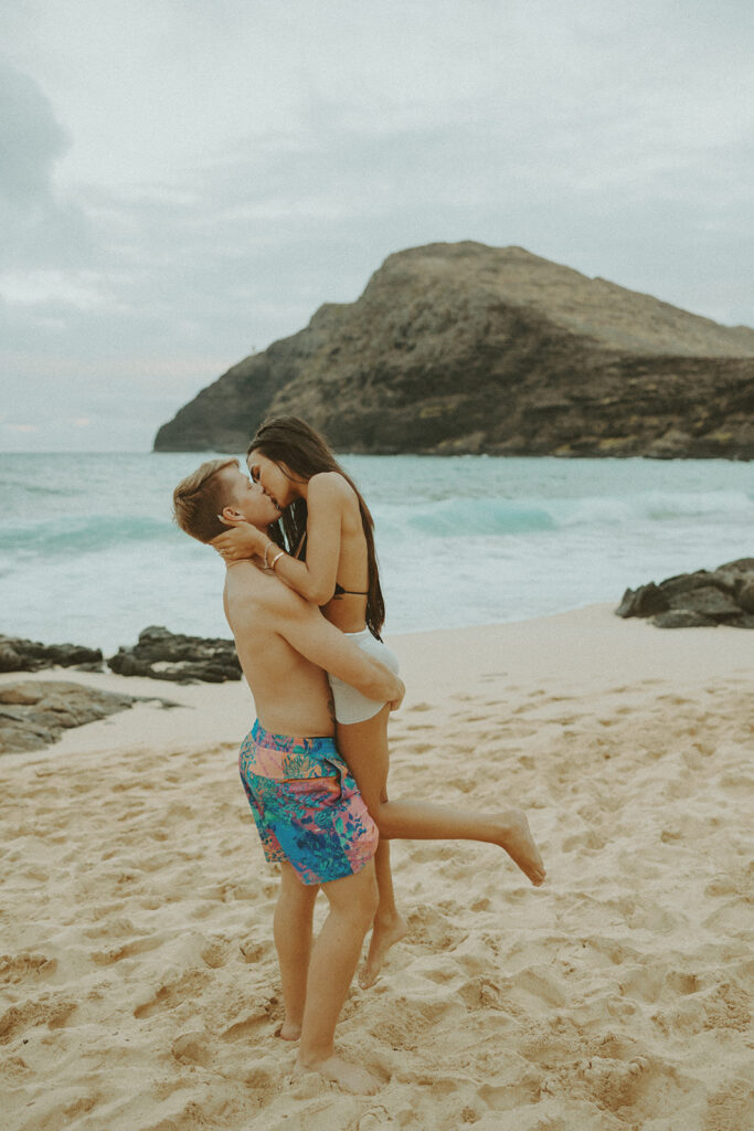 couple posing on the beaches of hawaii
