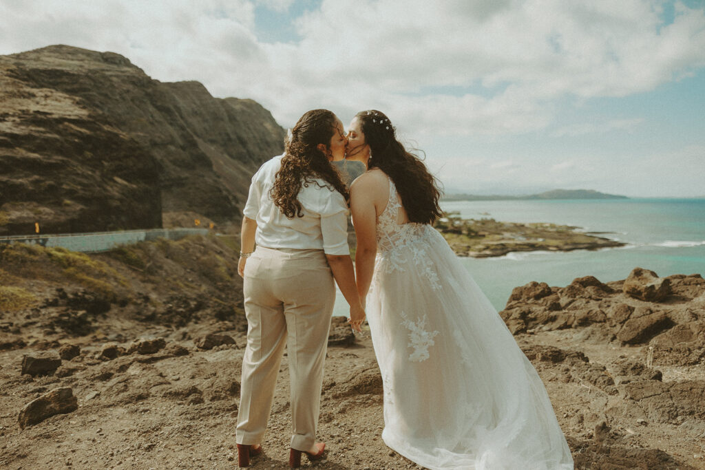an elopement photoshoot in hawaii with couple posing on the beach