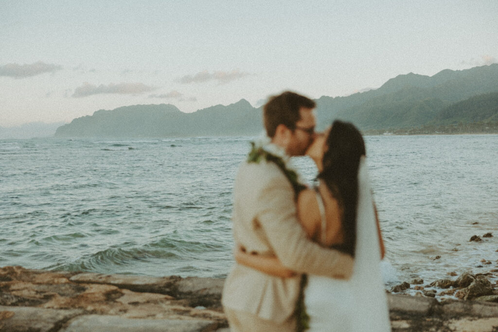Couple posing for wedding photos in oahu
