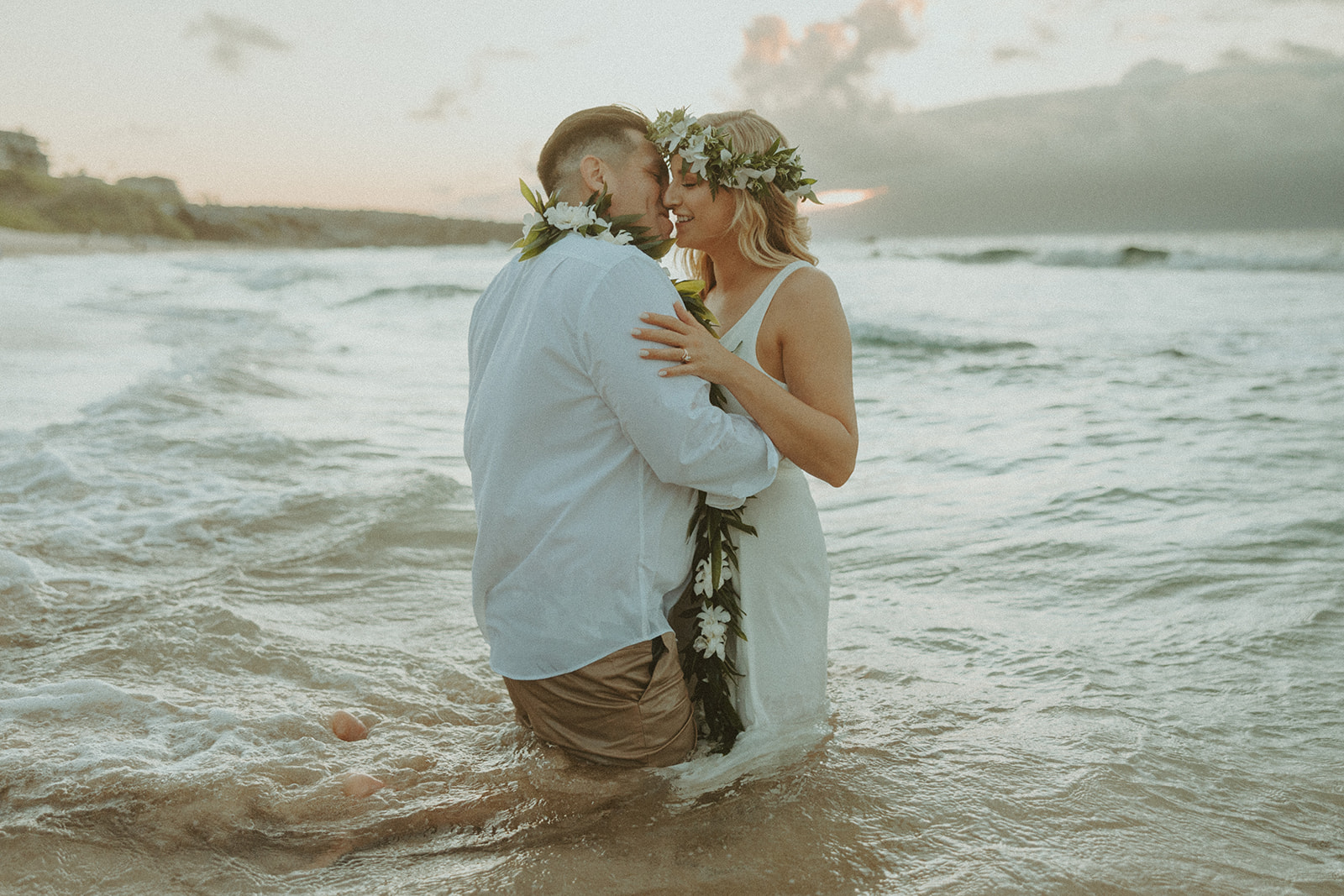 couple having a beachside elopement in hawaii