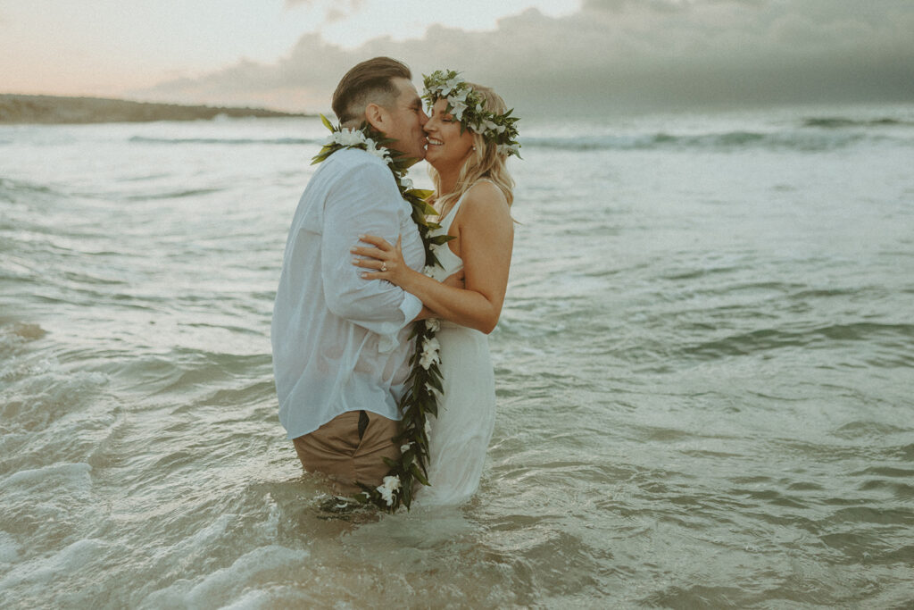 couple playing on the beach for their elopement pictures
