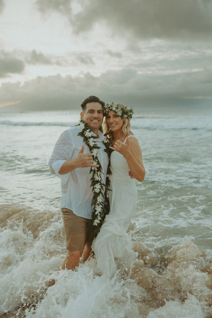 couple posing for their elopement photos in hawaii
