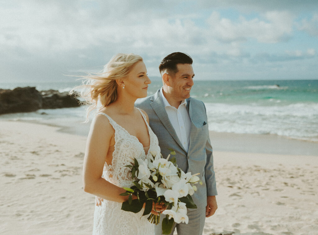 couple playing on the beach for their elopement pictures
