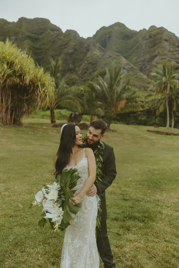 couple posing for wedding photos in hawaii
