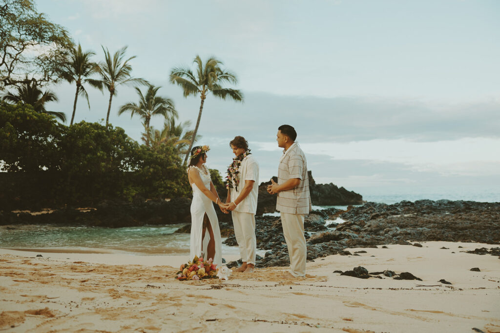 newlyweds taking elopement photos in hawaii
