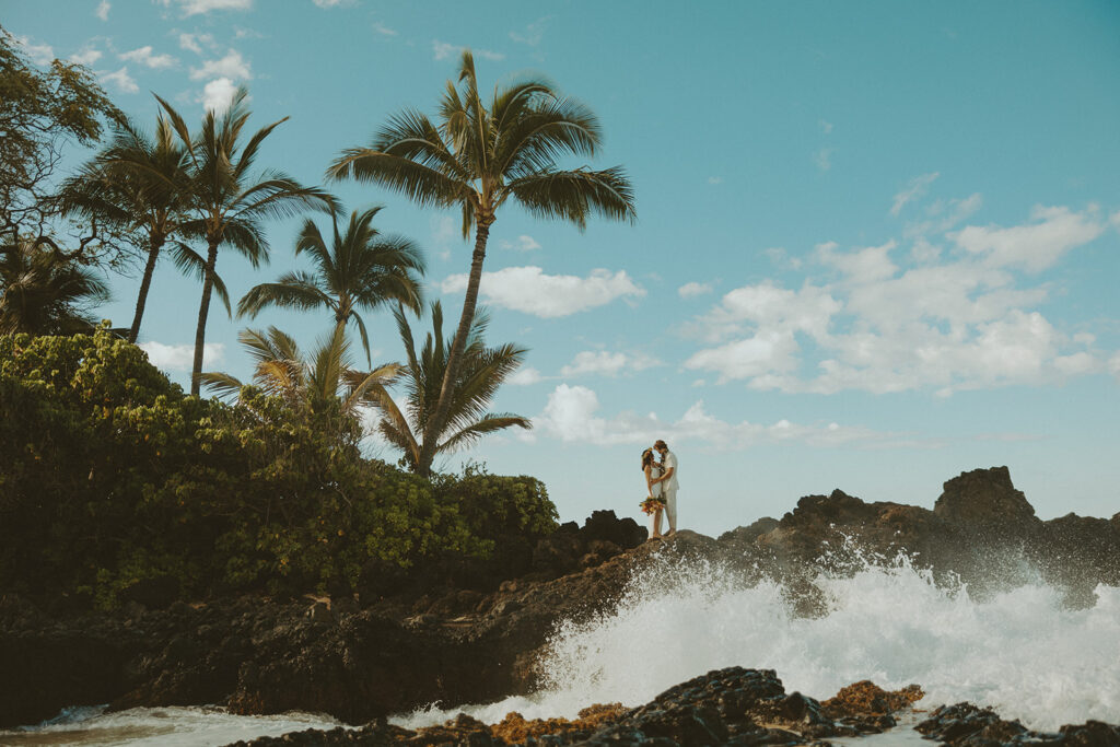 newlyweds taking elopement photos in hawaii