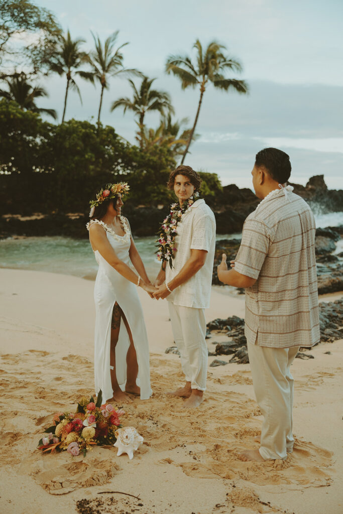 newlyweds taking elopement photos in hawaii
