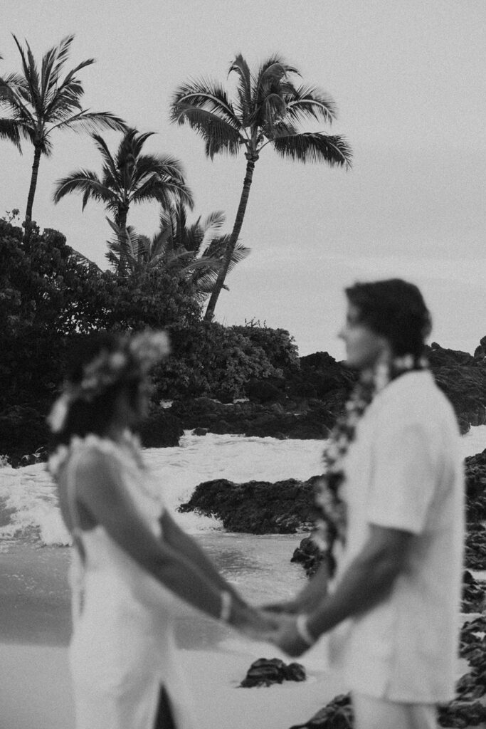 newlyweds taking elopement photos in hawaii
