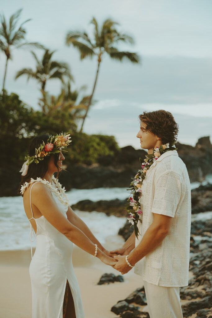 newlyweds taking elopement photos in hawaii
