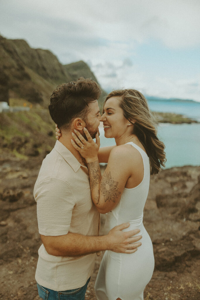 couples posing for their engagement photos in hawaii
