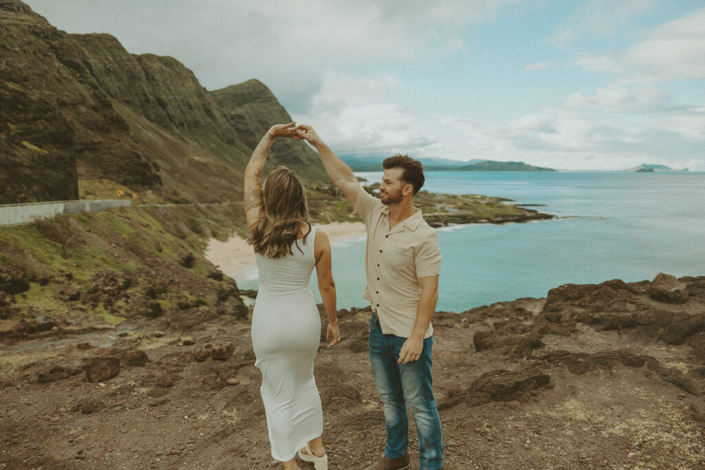 couples posing for their engagement photos in hawaii
